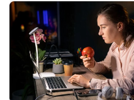 Professional working beside a laptop